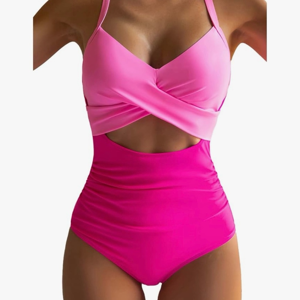 Hot pink/pink one piece bathing suit. New Hygiene strip still in place. Size M.